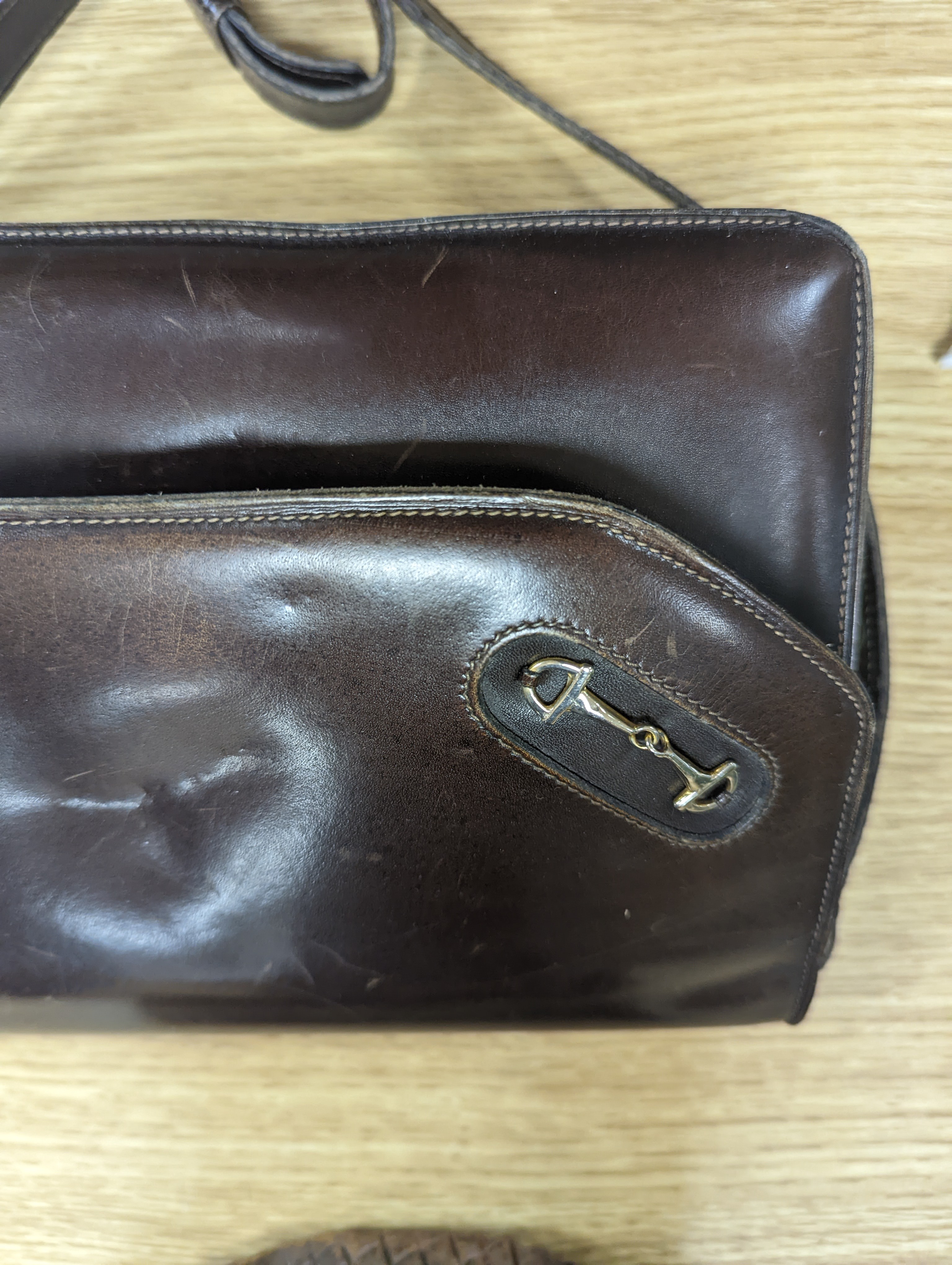A vintage brown leather handbag stamped 
